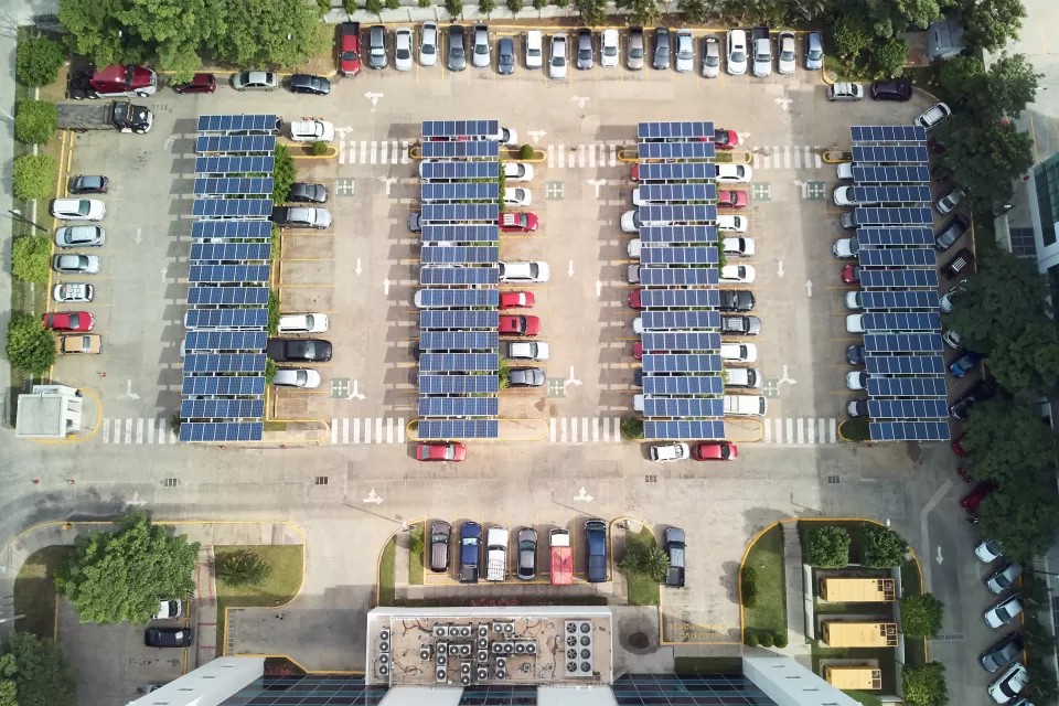 Bird's eye view of parking lot with solar panel canopies